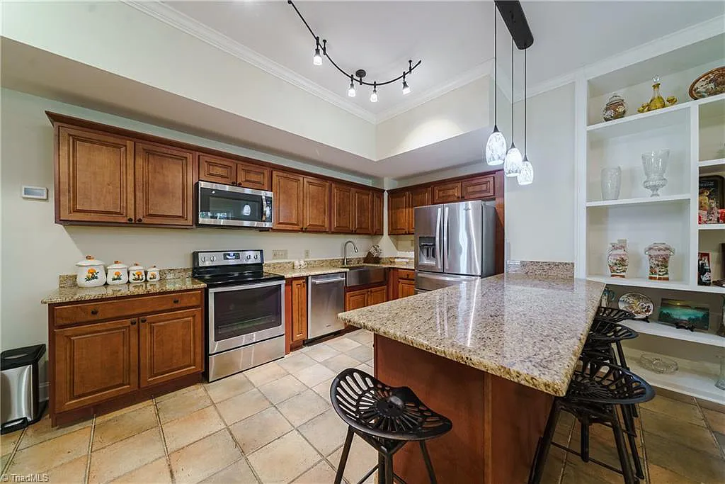 5712 Summit Road Home in Purlear, North Carolina. Explore this exceptional 128+ acre mountain retreat with a gated entrance, a timber-frame home boasting 5 bedrooms and 5 bathrooms. Enjoy the beauty of two spring-fed creeks that encircle the fieldstone exterior of the home.
