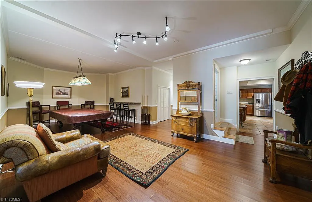 5712 Summit Road Home in Purlear, North Carolina. Explore this exceptional 128+ acre mountain retreat with a gated entrance, a timber-frame home boasting 5 bedrooms and 5 bathrooms. Enjoy the beauty of two spring-fed creeks that encircle the fieldstone exterior of the home.