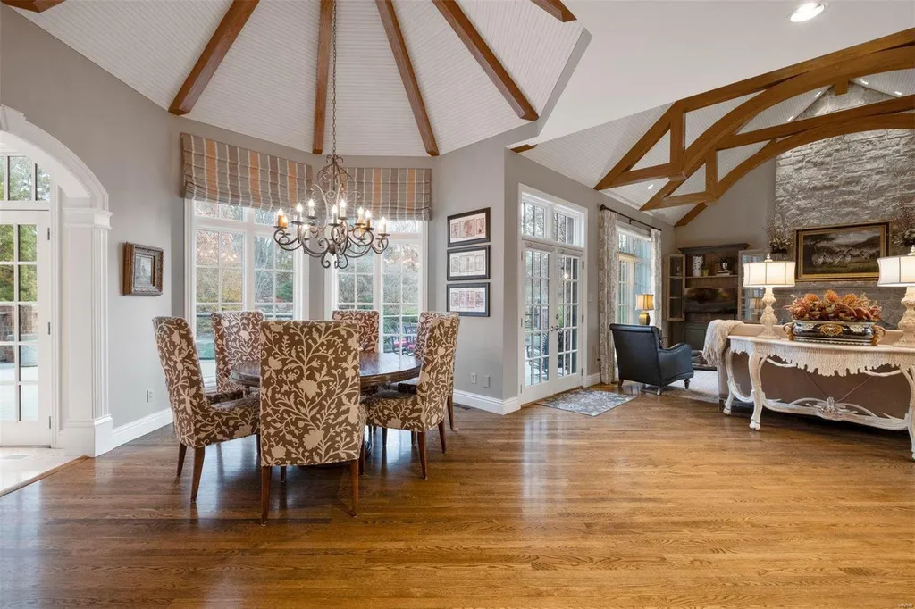 8 Lochinvar Drive Home in Saint Louis, Missouri. This stunning custom built home features a cascading waterfall, spacious living areas, and a finished lower level with every amenity. It is perfect for everyday living and entertaining.