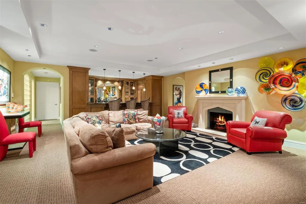 8 Lochinvar Drive Home in Saint Louis, Missouri. This stunning custom built home features a cascading waterfall, spacious living areas, and a finished lower level with every amenity. It is perfect for everyday living and entertaining.