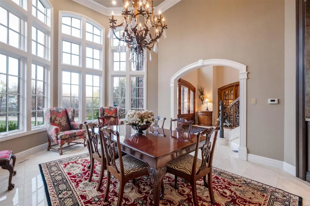 8 Lochinvar Drive Home in Saint Louis, Missouri. This stunning custom built home features a cascading waterfall, spacious living areas, and a finished lower level with every amenity. It is perfect for everyday living and entertaining.