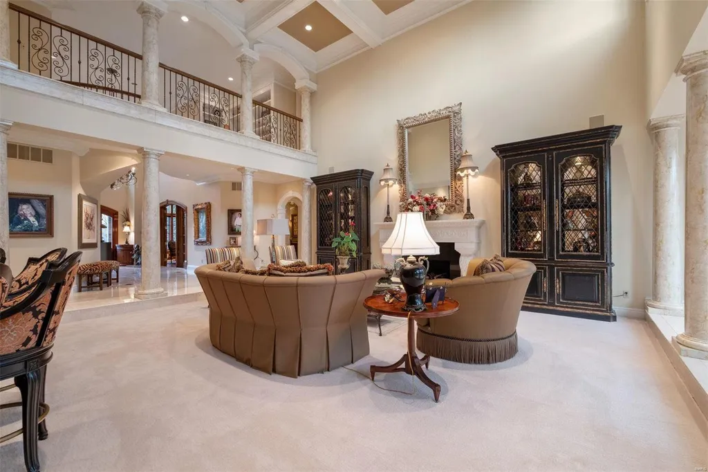 8 Lochinvar Drive Home in Saint Louis, Missouri. This stunning custom built home features a cascading waterfall, spacious living areas, and a finished lower level with every amenity. It is perfect for everyday living and entertaining.