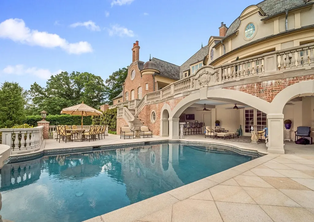 841 Merion Square Road Home in Gladwyne, Pennsylvania. This exceptional French Chateau estate, a rare gem designed by renowned architect F.L. Bissinger, awaits its new owner. Nestled on over 7 private and serene acres in prestigious Gladwyne, this regal compound is surrounded by meticulously manicured gardens, lush grounds, majestic fountains, and towering trees, offering an ambiance of unparalleled grandeur.
