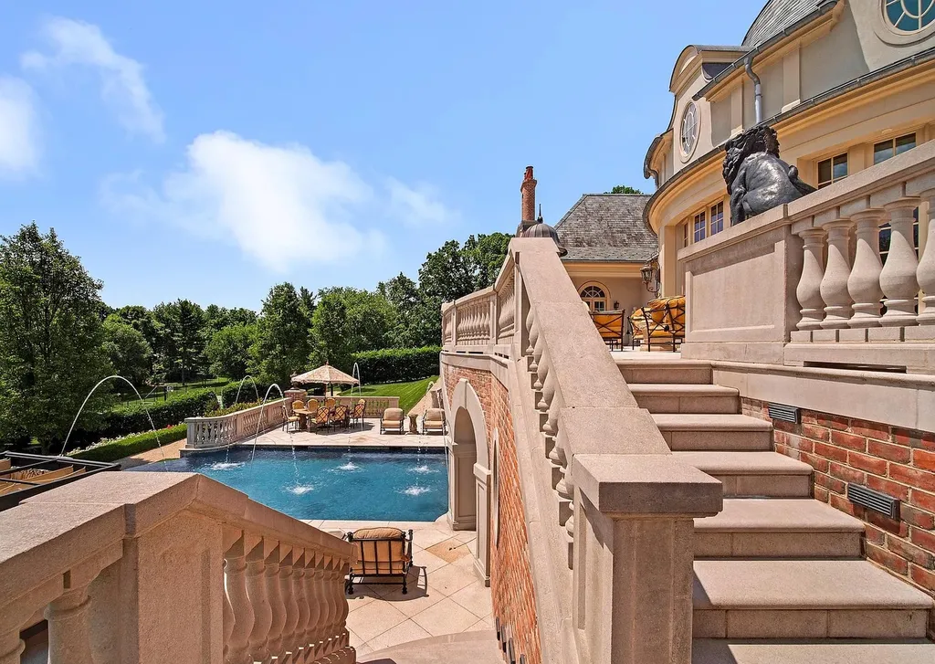 841 Merion Square Road Home in Gladwyne, Pennsylvania. This exceptional French Chateau estate, a rare gem designed by renowned architect F.L. Bissinger, awaits its new owner. Nestled on over 7 private and serene acres in prestigious Gladwyne, this regal compound is surrounded by meticulously manicured gardens, lush grounds, majestic fountains, and towering trees, offering an ambiance of unparalleled grandeur.