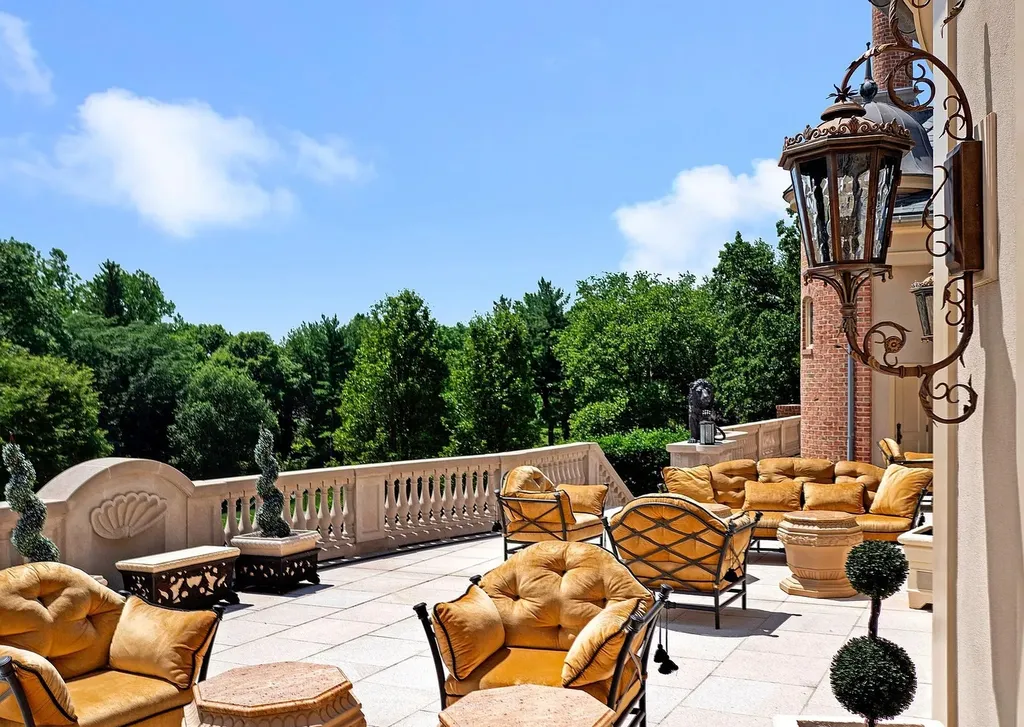 841 Merion Square Road Home in Gladwyne, Pennsylvania. This exceptional French Chateau estate, a rare gem designed by renowned architect F.L. Bissinger, awaits its new owner. Nestled on over 7 private and serene acres in prestigious Gladwyne, this regal compound is surrounded by meticulously manicured gardens, lush grounds, majestic fountains, and towering trees, offering an ambiance of unparalleled grandeur.