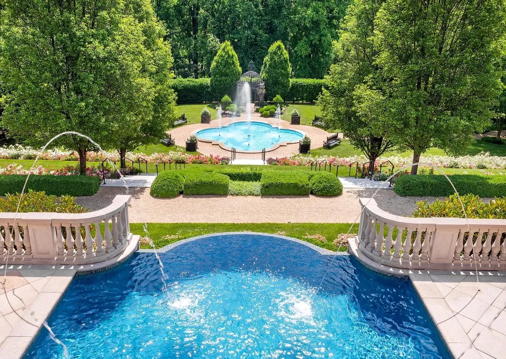 841 Merion Square Road Home in Gladwyne, Pennsylvania. This exceptional French Chateau estate, a rare gem designed by renowned architect F.L. Bissinger, awaits its new owner. Nestled on over 7 private and serene acres in prestigious Gladwyne, this regal compound is surrounded by meticulously manicured gardens, lush grounds, majestic fountains, and towering trees, offering an ambiance of unparalleled grandeur.