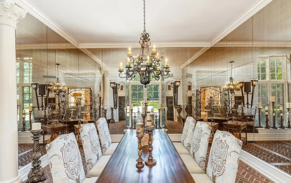 841 Merion Square Road Home in Gladwyne, Pennsylvania. This exceptional French Chateau estate, a rare gem designed by renowned architect F.L. Bissinger, awaits its new owner. Nestled on over 7 private and serene acres in prestigious Gladwyne, this regal compound is surrounded by meticulously manicured gardens, lush grounds, majestic fountains, and towering trees, offering an ambiance of unparalleled grandeur.