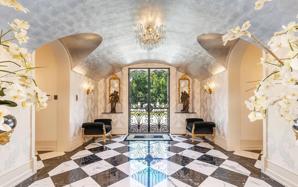 841 Merion Square Road Home in Gladwyne, Pennsylvania. This exceptional French Chateau estate, a rare gem designed by renowned architect F.L. Bissinger, awaits its new owner. Nestled on over 7 private and serene acres in prestigious Gladwyne, this regal compound is surrounded by meticulously manicured gardens, lush grounds, majestic fountains, and towering trees, offering an ambiance of unparalleled grandeur.