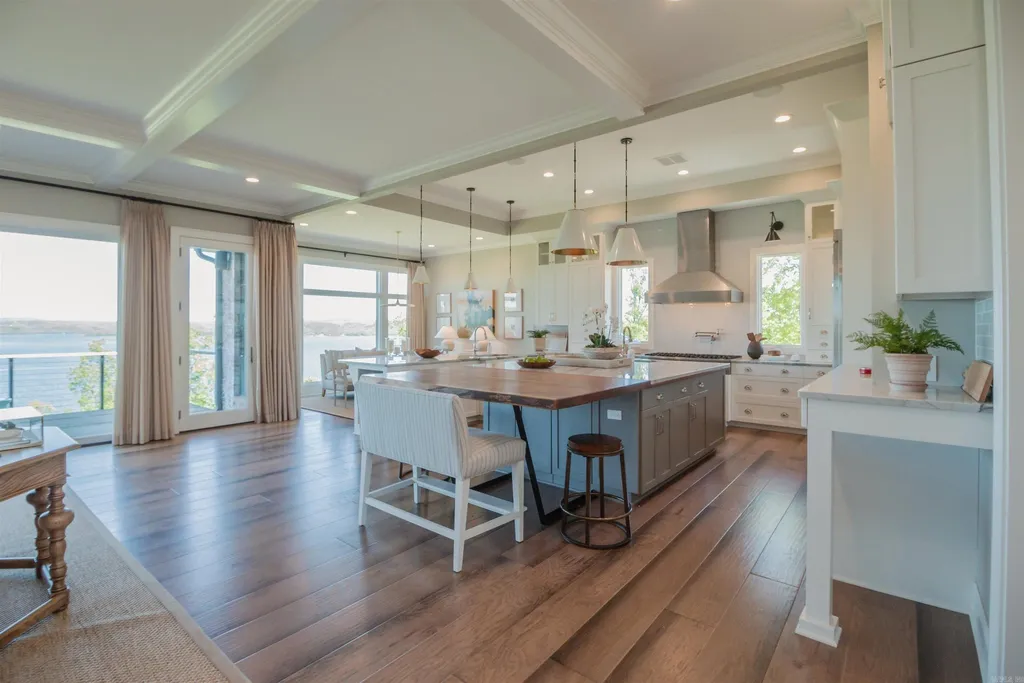 Lakefront Luxury Living: Exquisite Custom Home with Beaver Lake Views in Arkansas Listed at $3,850,000 18 8919 Castleberry Way Home in Rogers, Arkansas. Discover the epitome of luxury living on a sought-after .97-acre lot with breathtaking Beaver Lake views. This custom-built home is a masterpiece, boasting meticulously landscaped grounds and thoughtfully designed spaces for both formal and casual living.