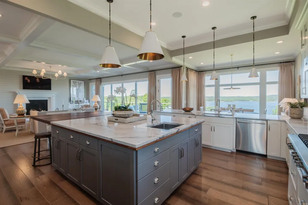 Lakefront Luxury Living: Exquisite Custom Home with Beaver Lake Views in Arkansas Listed at $3,850,000 21 8919 Castleberry Way Home in Rogers, Arkansas. Discover the epitome of luxury living on a sought-after .97-acre lot with breathtaking Beaver Lake views. This custom-built home is a masterpiece, boasting meticulously landscaped grounds and thoughtfully designed spaces for both formal and casual living.