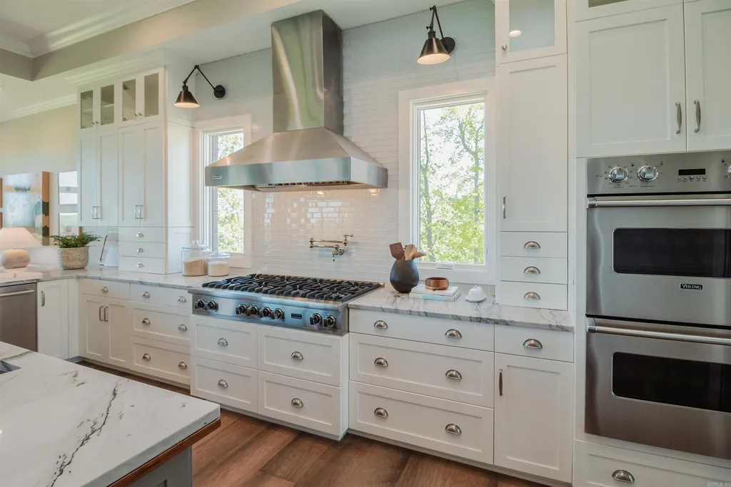 Lakefront Luxury Living: Exquisite Custom Home with Beaver Lake Views in Arkansas Listed at $3,850,000 24 8919 Castleberry Way Home in Rogers, Arkansas. Discover the epitome of luxury living on a sought-after .97-acre lot with breathtaking Beaver Lake views. This custom-built home is a masterpiece, boasting meticulously landscaped grounds and thoughtfully designed spaces for both formal and casual living.