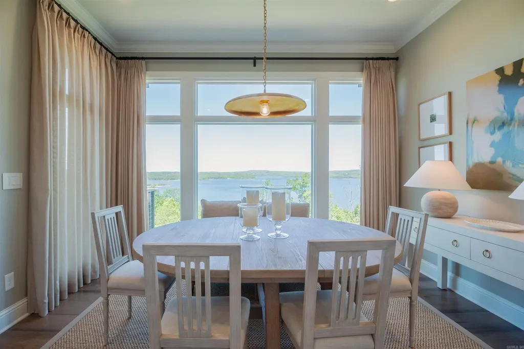 Lakefront Luxury Living: Exquisite Custom Home with Beaver Lake Views in Arkansas Listed at $3,850,000 25 8919 Castleberry Way Home in Rogers, Arkansas. Discover the epitome of luxury living on a sought-after .97-acre lot with breathtaking Beaver Lake views. This custom-built home is a masterpiece, boasting meticulously landscaped grounds and thoughtfully designed spaces for both formal and casual living.