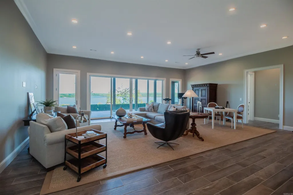 Lakefront Luxury Living: Exquisite Custom Home with Beaver Lake Views in Arkansas Listed at $3,850,000 31 8919 Castleberry Way Home in Rogers, Arkansas. Discover the epitome of luxury living on a sought-after .97-acre lot with breathtaking Beaver Lake views. This custom-built home is a masterpiece, boasting meticulously landscaped grounds and thoughtfully designed spaces for both formal and casual living.