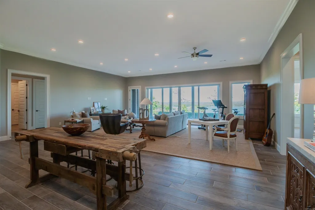 Lakefront Luxury Living: Exquisite Custom Home with Beaver Lake Views in Arkansas Listed at $3,850,000 32 8919 Castleberry Way Home in Rogers, Arkansas. Discover the epitome of luxury living on a sought-after .97-acre lot with breathtaking Beaver Lake views. This custom-built home is a masterpiece, boasting meticulously landscaped grounds and thoughtfully designed spaces for both formal and casual living.