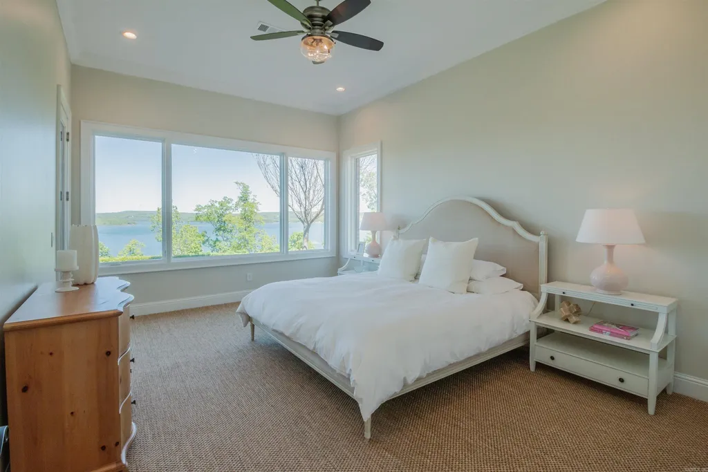 Lakefront Luxury Living: Exquisite Custom Home with Beaver Lake Views in Arkansas Listed at $3,850,000 36 8919 Castleberry Way Home in Rogers, Arkansas. Discover the epitome of luxury living on a sought-after .97-acre lot with breathtaking Beaver Lake views. This custom-built home is a masterpiece, boasting meticulously landscaped grounds and thoughtfully designed spaces for both formal and casual living.