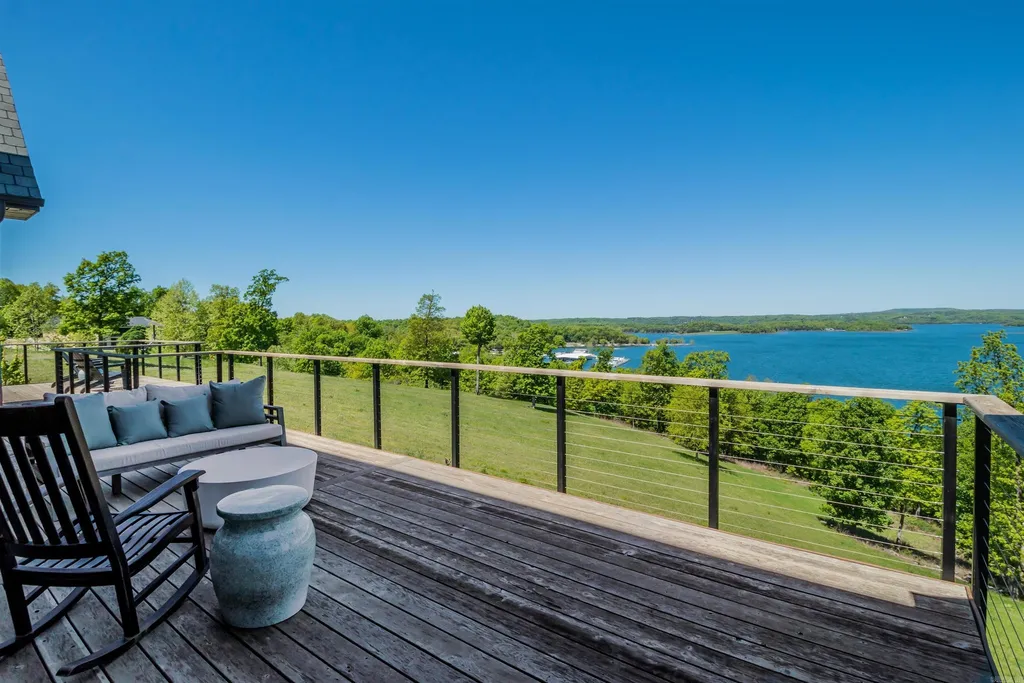 Lakefront Luxury Living: Exquisite Custom Home with Beaver Lake Views in Arkansas Listed at $3,850,000 40 8919 Castleberry Way Home in Rogers, Arkansas. Discover the epitome of luxury living on a sought-after .97-acre lot with breathtaking Beaver Lake views. This custom-built home is a masterpiece, boasting meticulously landscaped grounds and thoughtfully designed spaces for both formal and casual living.