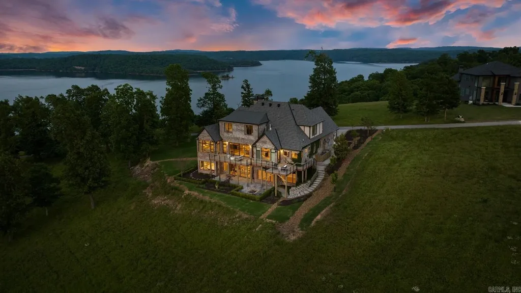 Lakefront Luxury Living: Exquisite Custom Home with Beaver Lake Views in Arkansas Listed at $3,850,000 5 8919 Castleberry Way Home in Rogers, Arkansas. Discover the epitome of luxury living on a sought-after .97-acre lot with breathtaking Beaver Lake views. This custom-built home is a masterpiece, boasting meticulously landscaped grounds and thoughtfully designed spaces for both formal and casual living.