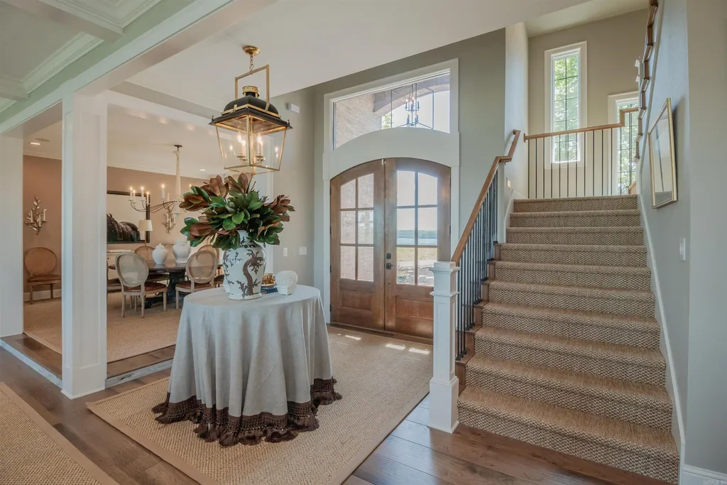 Lakefront Luxury Living: Exquisite Custom Home with Beaver Lake Views in Arkansas Listed at $3,850,000 10 8919 Castleberry Way Home in Rogers, Arkansas. Discover the epitome of luxury living on a sought-after .97-acre lot with breathtaking Beaver Lake views. This custom-built home is a masterpiece, boasting meticulously landscaped grounds and thoughtfully designed spaces for both formal and casual living.