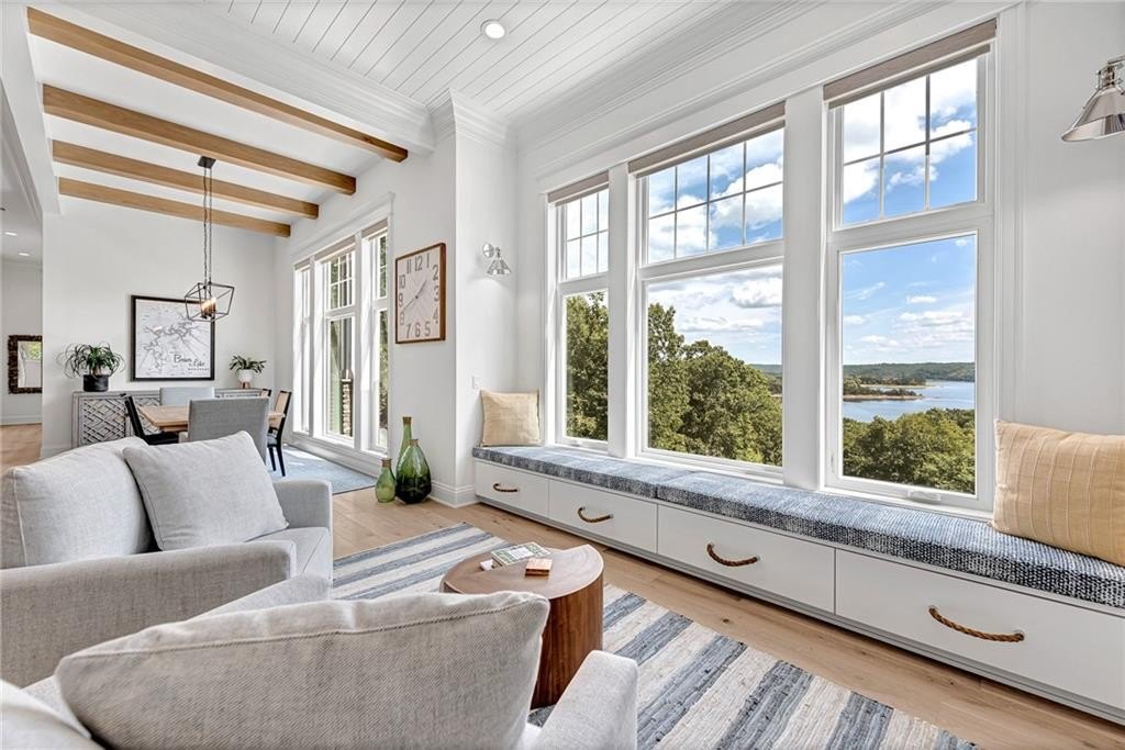 9966 Old Campbell Road Home in Rogers, Arkansas. Prepare to be captivated by this extraordinary 5-bedroom, 6.5-bathroom, 8,321 sqft estate, nestled on 6 acres in Rogers. It includes ownership of TWO slips in a co-owned boat dock, granting exclusive access to pristine Beaver Lake.