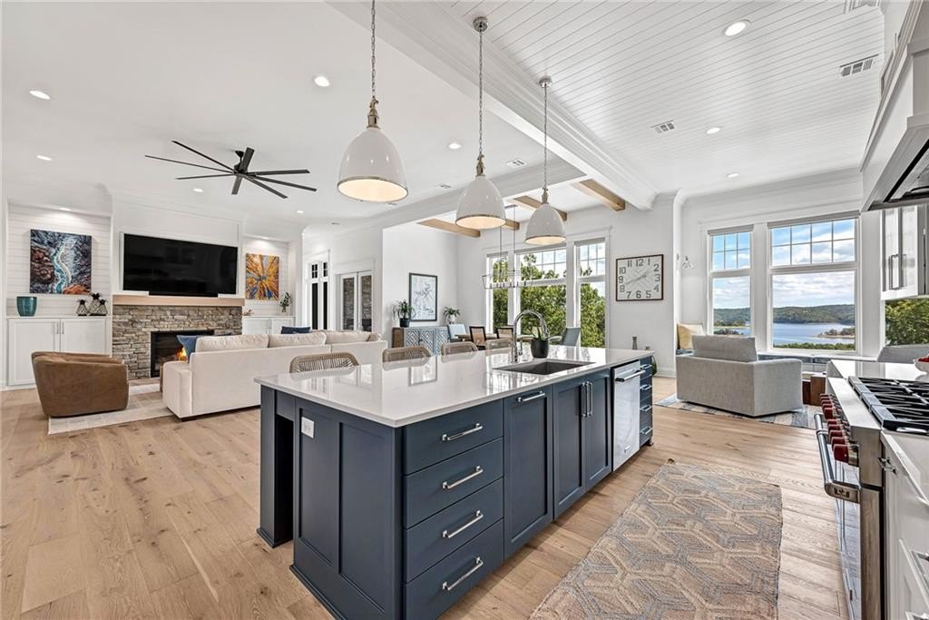 9966 Old Campbell Road Home in Rogers, Arkansas. Prepare to be captivated by this extraordinary 5-bedroom, 6.5-bathroom, 8,321 sqft estate, nestled on 6 acres in Rogers. It includes ownership of TWO slips in a co-owned boat dock, granting exclusive access to pristine Beaver Lake.
