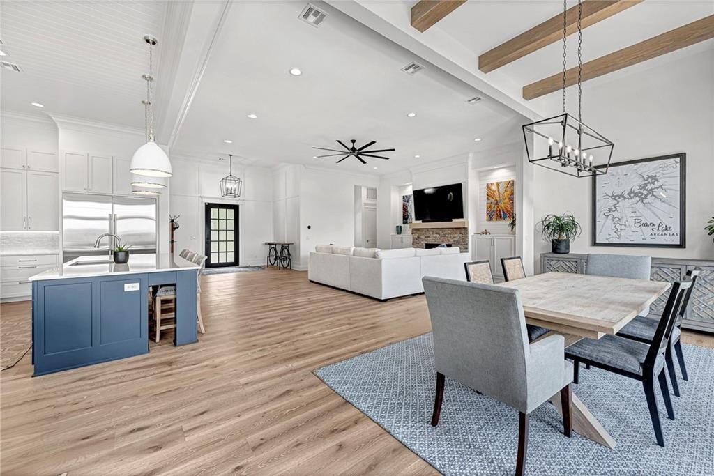 9966 Old Campbell Road Home in Rogers, Arkansas. Prepare to be captivated by this extraordinary 5-bedroom, 6.5-bathroom, 8,321 sqft estate, nestled on 6 acres in Rogers. It includes ownership of TWO slips in a co-owned boat dock, granting exclusive access to pristine Beaver Lake.