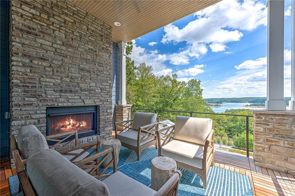 9966 Old Campbell Road Home in Rogers, Arkansas. Prepare to be captivated by this extraordinary 5-bedroom, 6.5-bathroom, 8,321 sqft estate, nestled on 6 acres in Rogers. It includes ownership of TWO slips in a co-owned boat dock, granting exclusive access to pristine Beaver Lake.