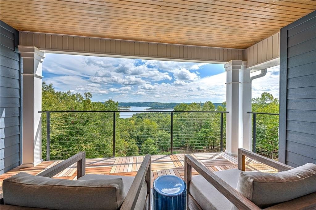 9966 Old Campbell Road Home in Rogers, Arkansas. Prepare to be captivated by this extraordinary 5-bedroom, 6.5-bathroom, 8,321 sqft estate, nestled on 6 acres in Rogers. It includes ownership of TWO slips in a co-owned boat dock, granting exclusive access to pristine Beaver Lake.