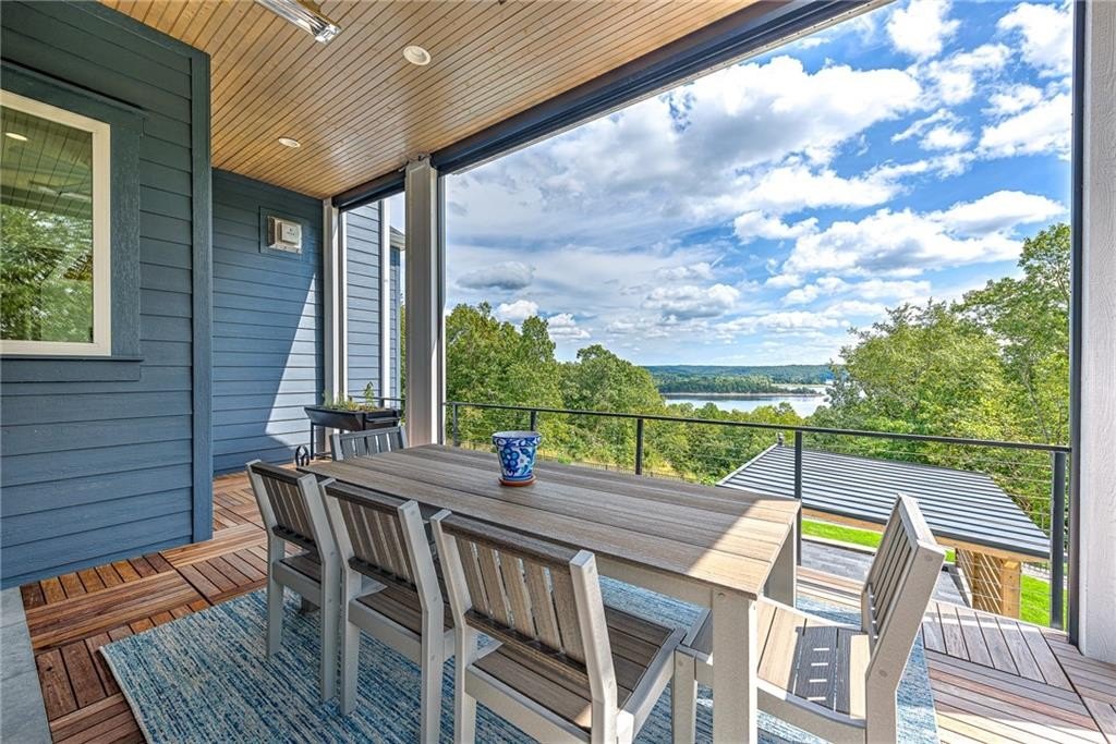 9966 Old Campbell Road Home in Rogers, Arkansas. Prepare to be captivated by this extraordinary 5-bedroom, 6.5-bathroom, 8,321 sqft estate, nestled on 6 acres in Rogers. It includes ownership of TWO slips in a co-owned boat dock, granting exclusive access to pristine Beaver Lake.