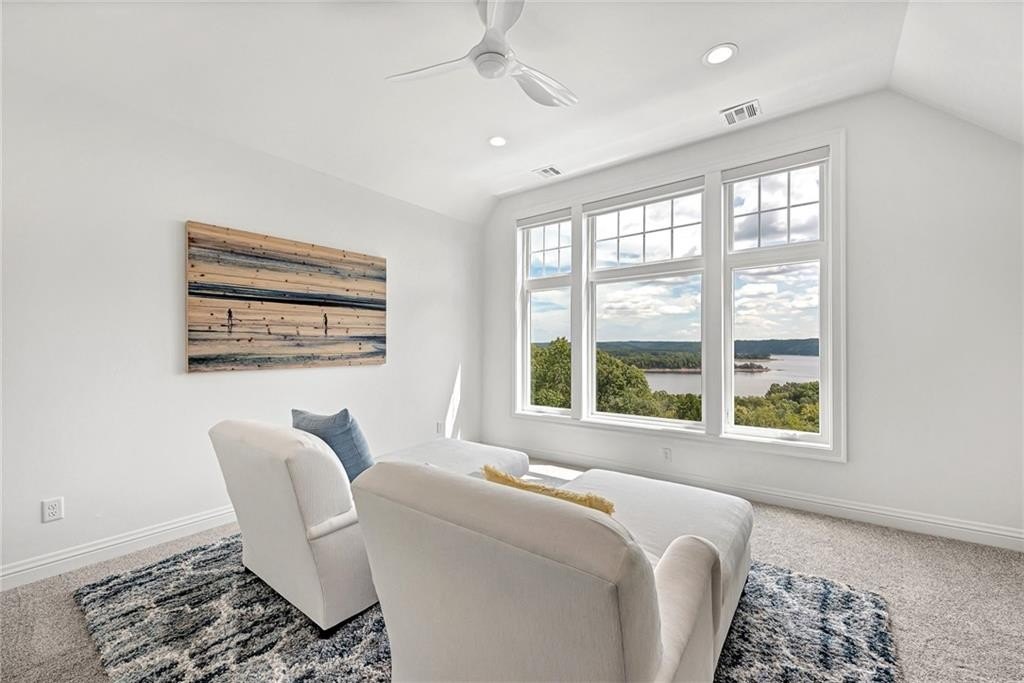 9966 Old Campbell Road Home in Rogers, Arkansas. Prepare to be captivated by this extraordinary 5-bedroom, 6.5-bathroom, 8,321 sqft estate, nestled on 6 acres in Rogers. It includes ownership of TWO slips in a co-owned boat dock, granting exclusive access to pristine Beaver Lake.