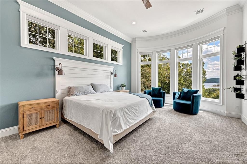 9966 Old Campbell Road Home in Rogers, Arkansas. Prepare to be captivated by this extraordinary 5-bedroom, 6.5-bathroom, 8,321 sqft estate, nestled on 6 acres in Rogers. It includes ownership of TWO slips in a co-owned boat dock, granting exclusive access to pristine Beaver Lake.