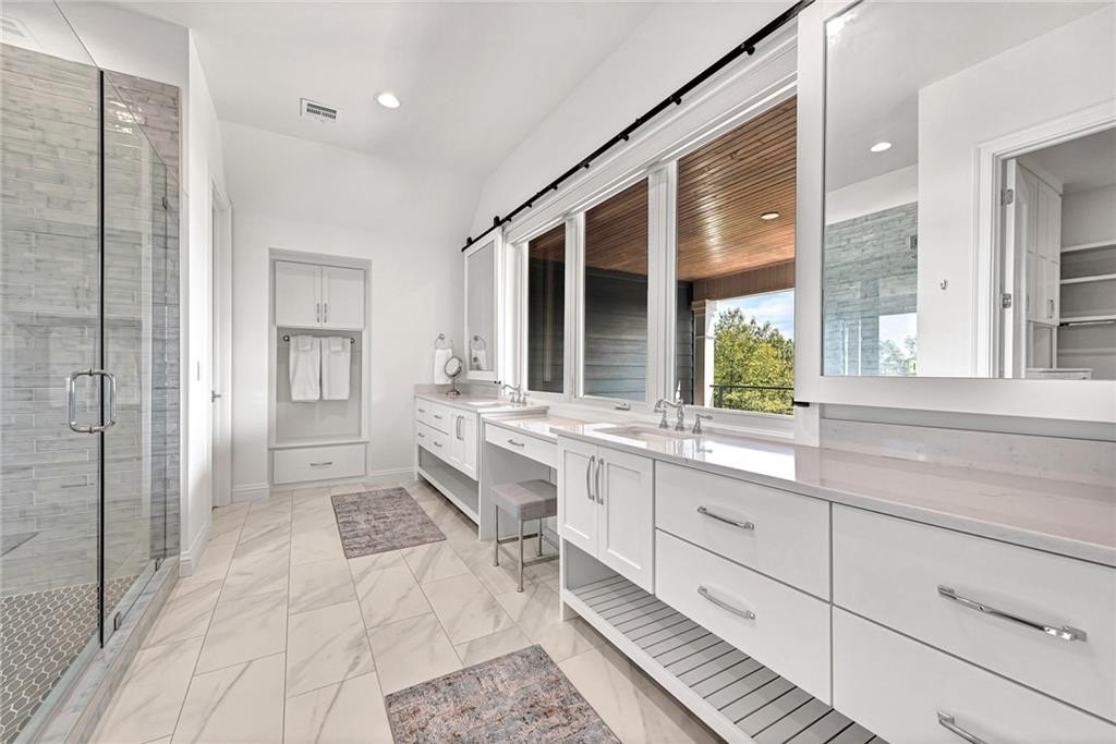 9966 Old Campbell Road Home in Rogers, Arkansas. Prepare to be captivated by this extraordinary 5-bedroom, 6.5-bathroom, 8,321 sqft estate, nestled on 6 acres in Rogers. It includes ownership of TWO slips in a co-owned boat dock, granting exclusive access to pristine Beaver Lake.