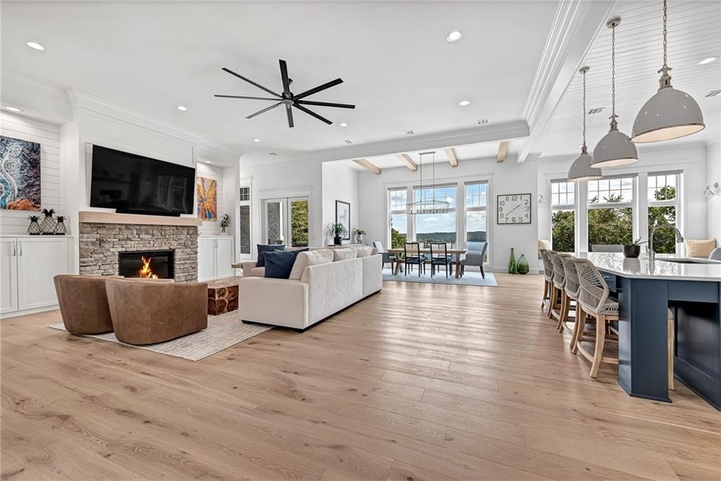 9966 Old Campbell Road Home in Rogers, Arkansas. Prepare to be captivated by this extraordinary 5-bedroom, 6.5-bathroom, 8,321 sqft estate, nestled on 6 acres in Rogers. It includes ownership of TWO slips in a co-owned boat dock, granting exclusive access to pristine Beaver Lake.