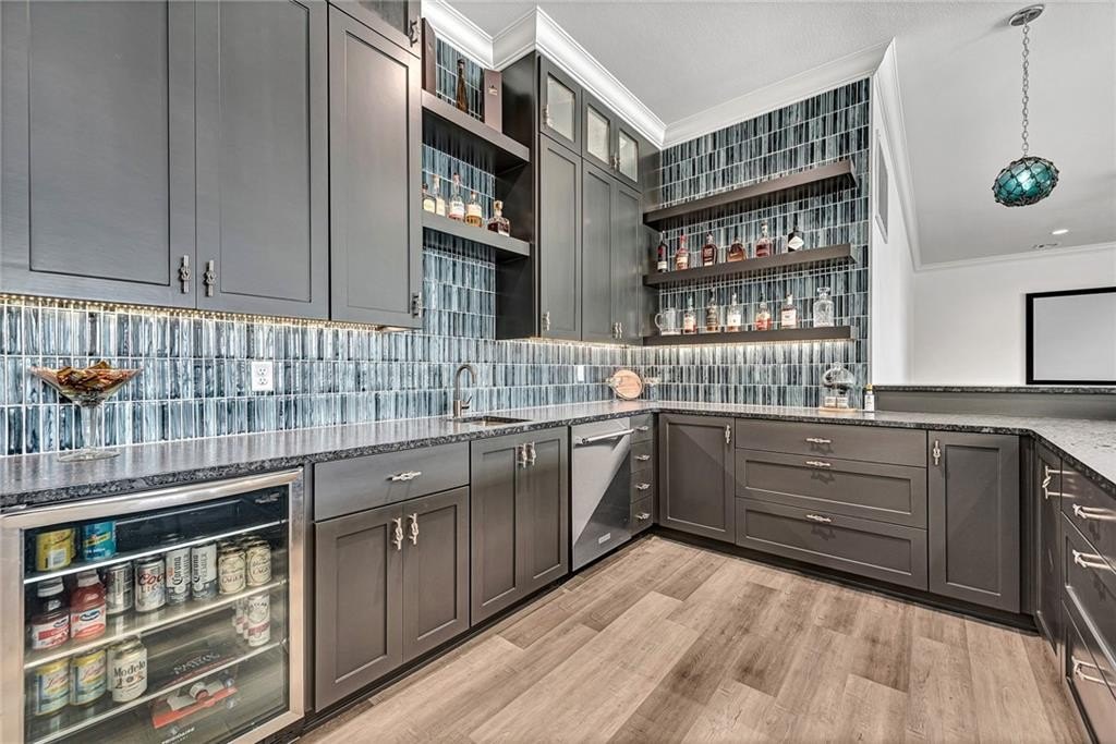 9966 Old Campbell Road Home in Rogers, Arkansas. Prepare to be captivated by this extraordinary 5-bedroom, 6.5-bathroom, 8,321 sqft estate, nestled on 6 acres in Rogers. It includes ownership of TWO slips in a co-owned boat dock, granting exclusive access to pristine Beaver Lake.