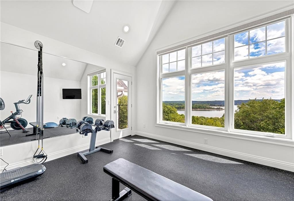 9966 Old Campbell Road Home in Rogers, Arkansas. Prepare to be captivated by this extraordinary 5-bedroom, 6.5-bathroom, 8,321 sqft estate, nestled on 6 acres in Rogers. It includes ownership of TWO slips in a co-owned boat dock, granting exclusive access to pristine Beaver Lake.