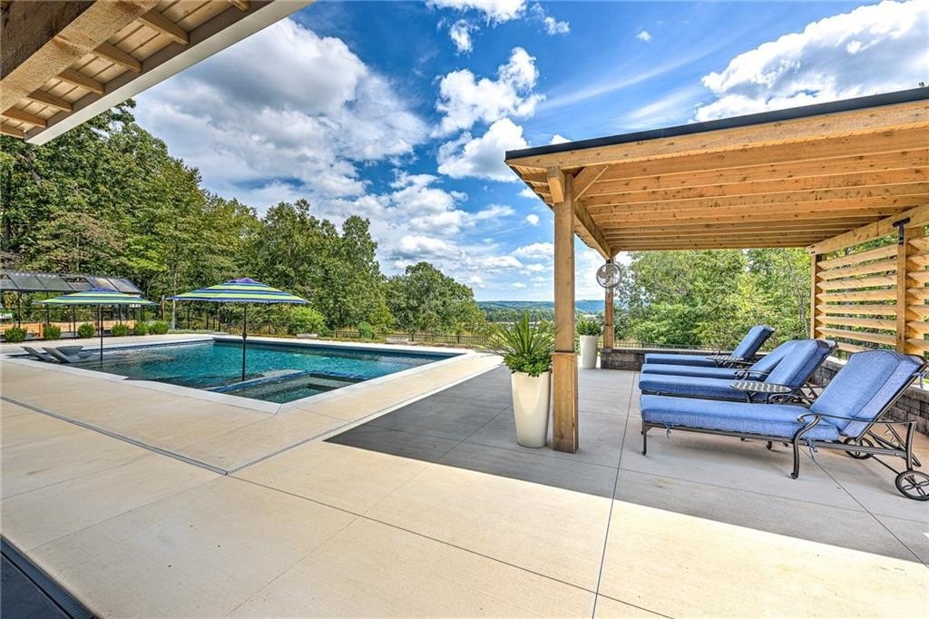 9966 Old Campbell Road Home in Rogers, Arkansas. Prepare to be captivated by this extraordinary 5-bedroom, 6.5-bathroom, 8,321 sqft estate, nestled on 6 acres in Rogers. It includes ownership of TWO slips in a co-owned boat dock, granting exclusive access to pristine Beaver Lake.