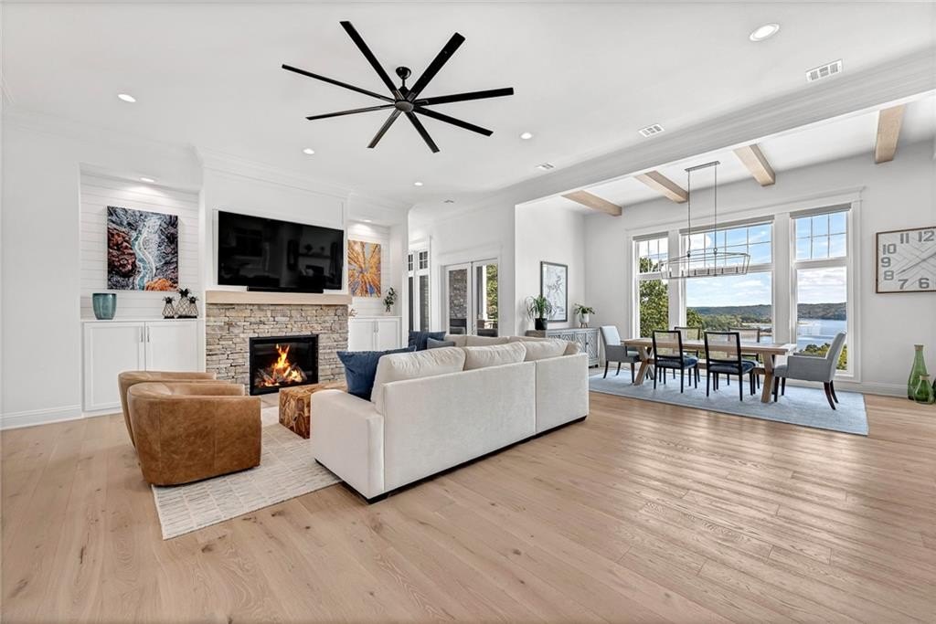 9966 Old Campbell Road Home in Rogers, Arkansas. Prepare to be captivated by this extraordinary 5-bedroom, 6.5-bathroom, 8,321 sqft estate, nestled on 6 acres in Rogers. It includes ownership of TWO slips in a co-owned boat dock, granting exclusive access to pristine Beaver Lake.