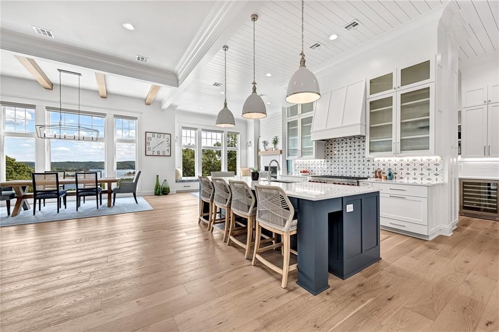9966 Old Campbell Road Home in Rogers, Arkansas. Prepare to be captivated by this extraordinary 5-bedroom, 6.5-bathroom, 8,321 sqft estate, nestled on 6 acres in Rogers. It includes ownership of TWO slips in a co-owned boat dock, granting exclusive access to pristine Beaver Lake.