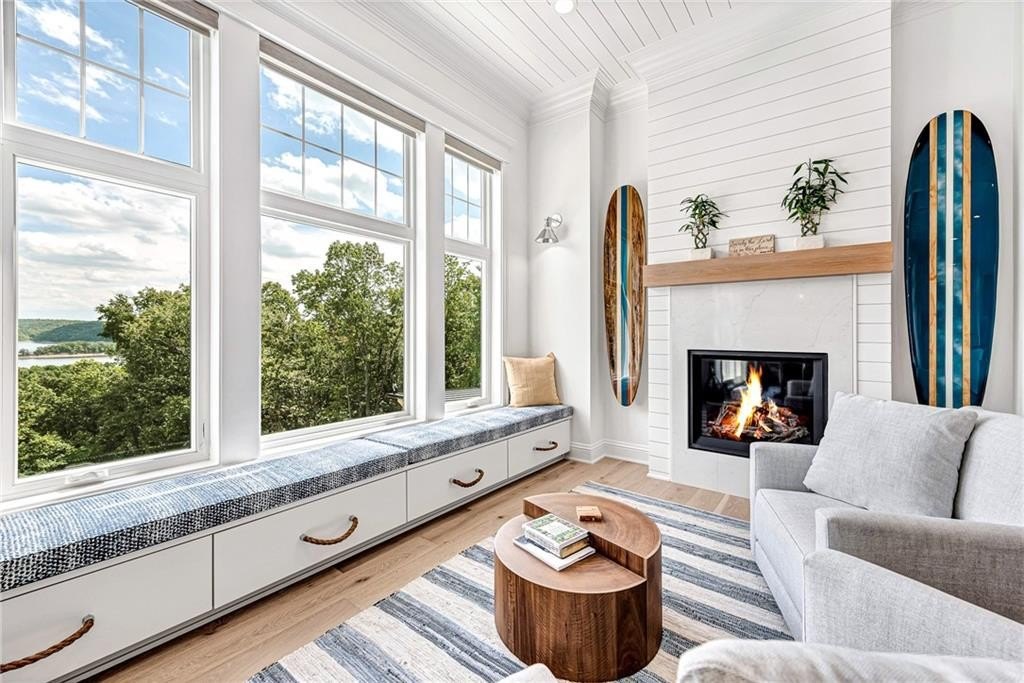 9966 Old Campbell Road Home in Rogers, Arkansas. Prepare to be captivated by this extraordinary 5-bedroom, 6.5-bathroom, 8,321 sqft estate, nestled on 6 acres in Rogers. It includes ownership of TWO slips in a co-owned boat dock, granting exclusive access to pristine Beaver Lake.