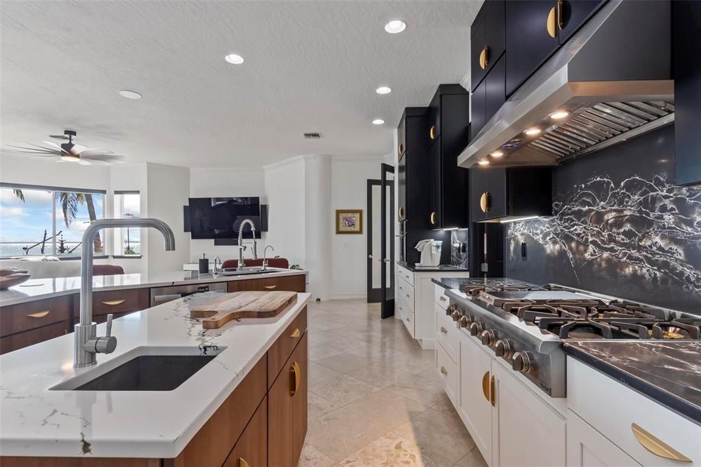 Discover the epitome of luxury living at 2 River Falls Drive, Cocoa Beach, Florida. This 5-bedroom, 6-bathroom custom estate, fully remodeled in 2022, offers 150 feet of pristine river frontage and unobstructed views.