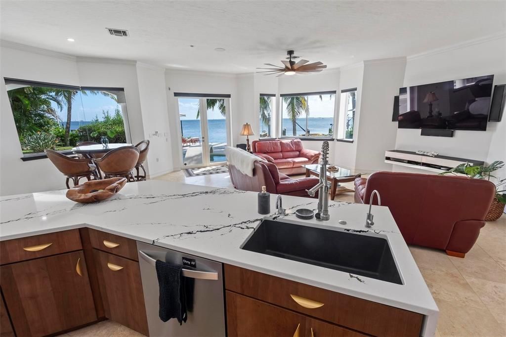 Discover the epitome of luxury living at 2 River Falls Drive, Cocoa Beach, Florida. This 5-bedroom, 6-bathroom custom estate, fully remodeled in 2022, offers 150 feet of pristine river frontage and unobstructed views.