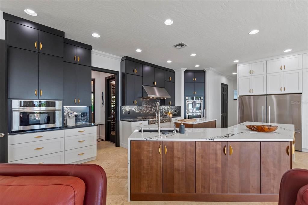 Discover the epitome of luxury living at 2 River Falls Drive, Cocoa Beach, Florida. This 5-bedroom, 6-bathroom custom estate, fully remodeled in 2022, offers 150 feet of pristine river frontage and unobstructed views.