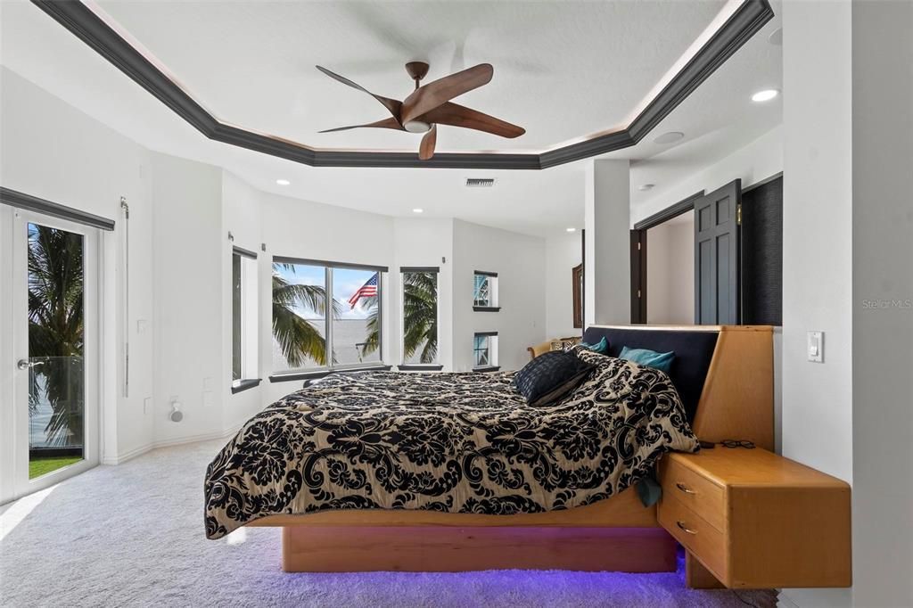 Discover the epitome of luxury living at 2 River Falls Drive, Cocoa Beach, Florida. This 5-bedroom, 6-bathroom custom estate, fully remodeled in 2022, offers 150 feet of pristine river frontage and unobstructed views.