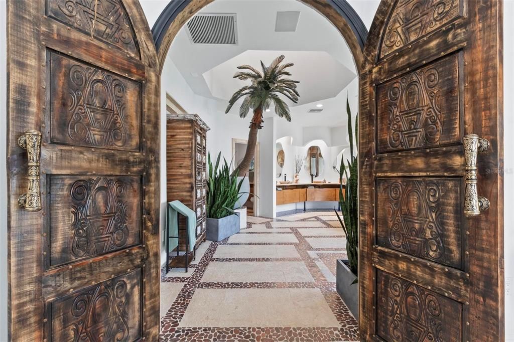 Discover the epitome of luxury living at 2 River Falls Drive, Cocoa Beach, Florida. This 5-bedroom, 6-bathroom custom estate, fully remodeled in 2022, offers 150 feet of pristine river frontage and unobstructed views.