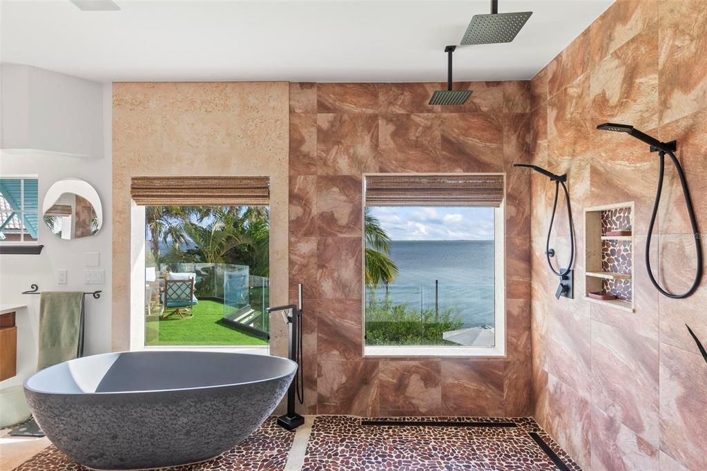 Discover the epitome of luxury living at 2 River Falls Drive, Cocoa Beach, Florida. This 5-bedroom, 6-bathroom custom estate, fully remodeled in 2022, offers 150 feet of pristine river frontage and unobstructed views.