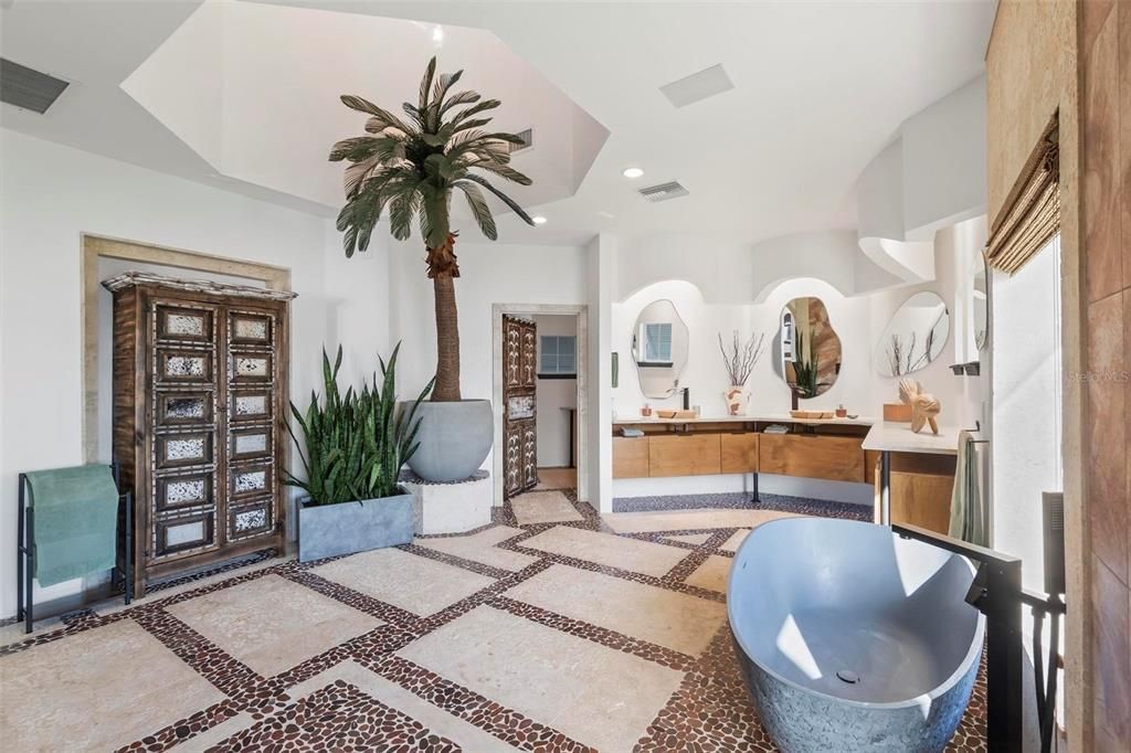 Discover the epitome of luxury living at 2 River Falls Drive, Cocoa Beach, Florida. This 5-bedroom, 6-bathroom custom estate, fully remodeled in 2022, offers 150 feet of pristine river frontage and unobstructed views.
