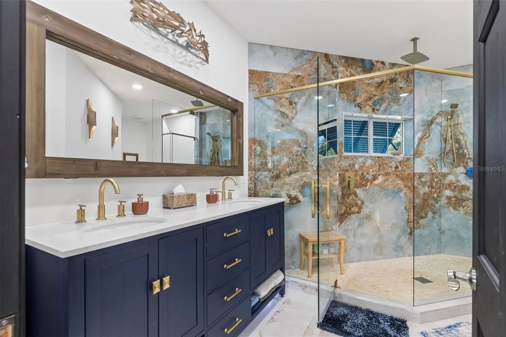 Discover the epitome of luxury living at 2 River Falls Drive, Cocoa Beach, Florida. This 5-bedroom, 6-bathroom custom estate, fully remodeled in 2022, offers 150 feet of pristine river frontage and unobstructed views.