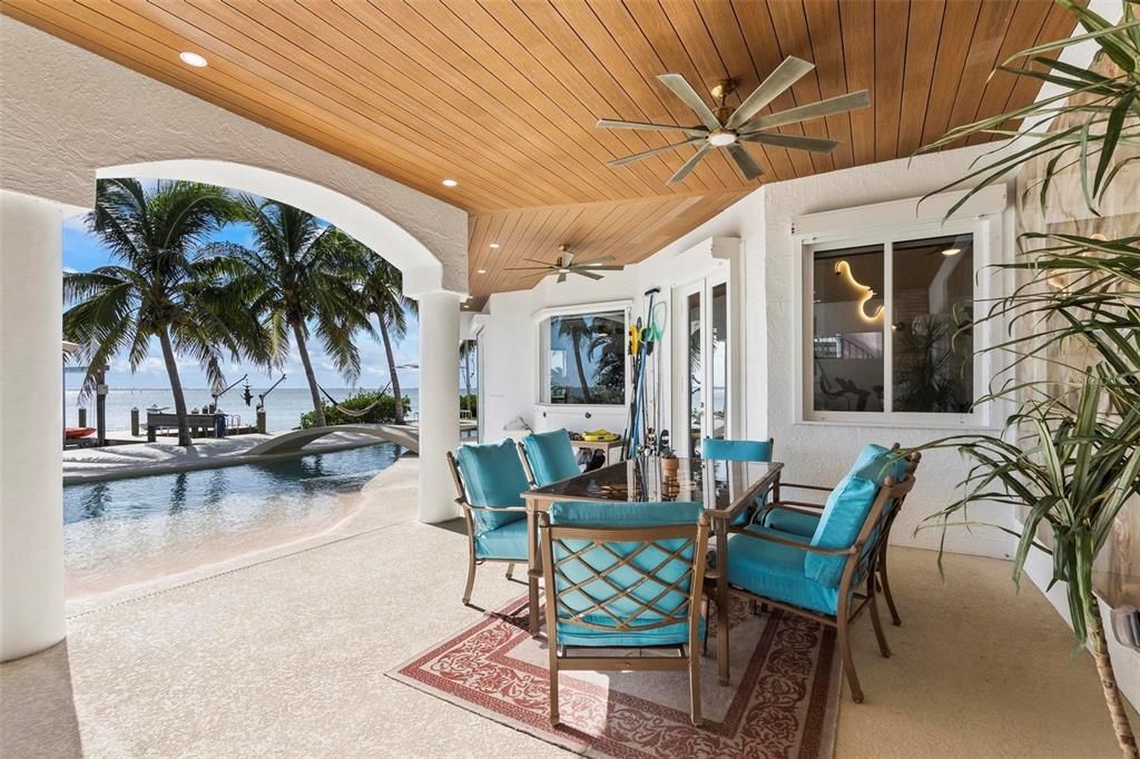 Discover the epitome of luxury living at 2 River Falls Drive, Cocoa Beach, Florida. This 5-bedroom, 6-bathroom custom estate, fully remodeled in 2022, offers 150 feet of pristine river frontage and unobstructed views.