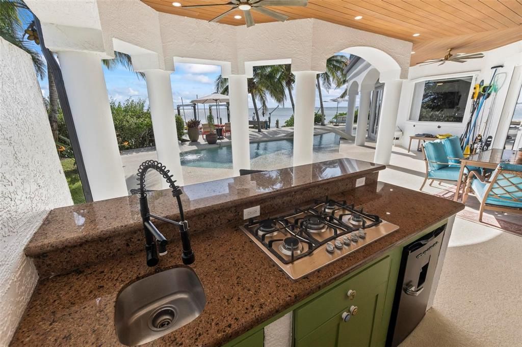 Discover the epitome of luxury living at 2 River Falls Drive, Cocoa Beach, Florida. This 5-bedroom, 6-bathroom custom estate, fully remodeled in 2022, offers 150 feet of pristine river frontage and unobstructed views.