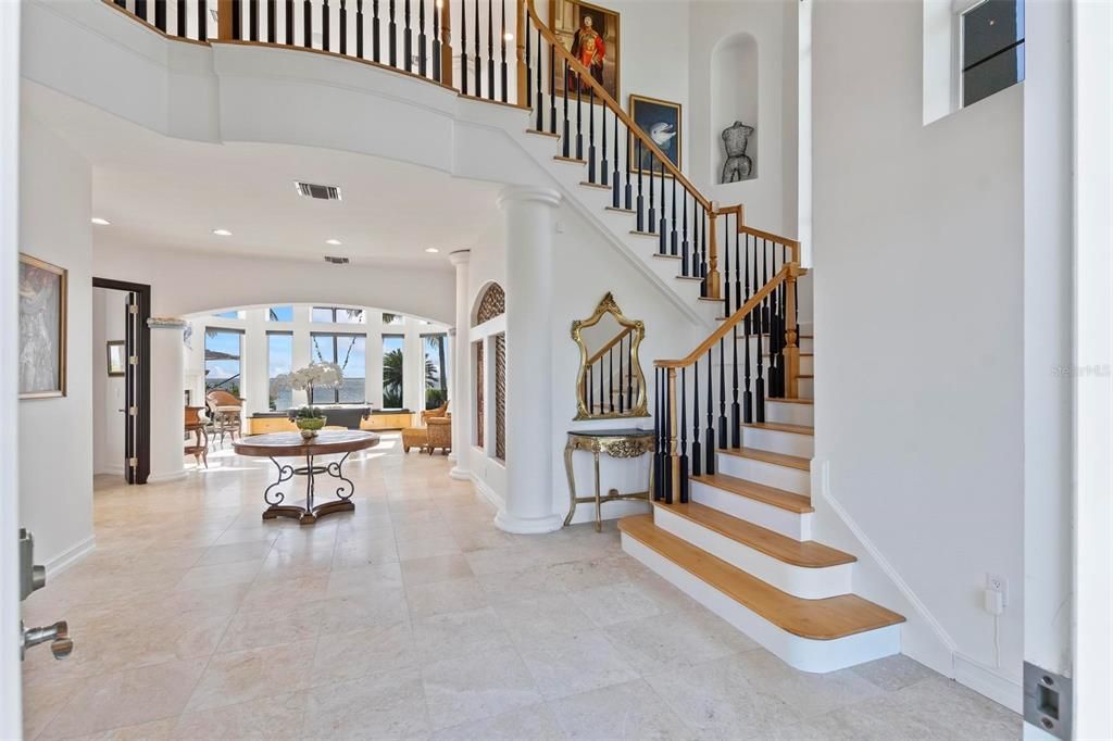 Discover the epitome of luxury living at 2 River Falls Drive, Cocoa Beach, Florida. This 5-bedroom, 6-bathroom custom estate, fully remodeled in 2022, offers 150 feet of pristine river frontage and unobstructed views.
