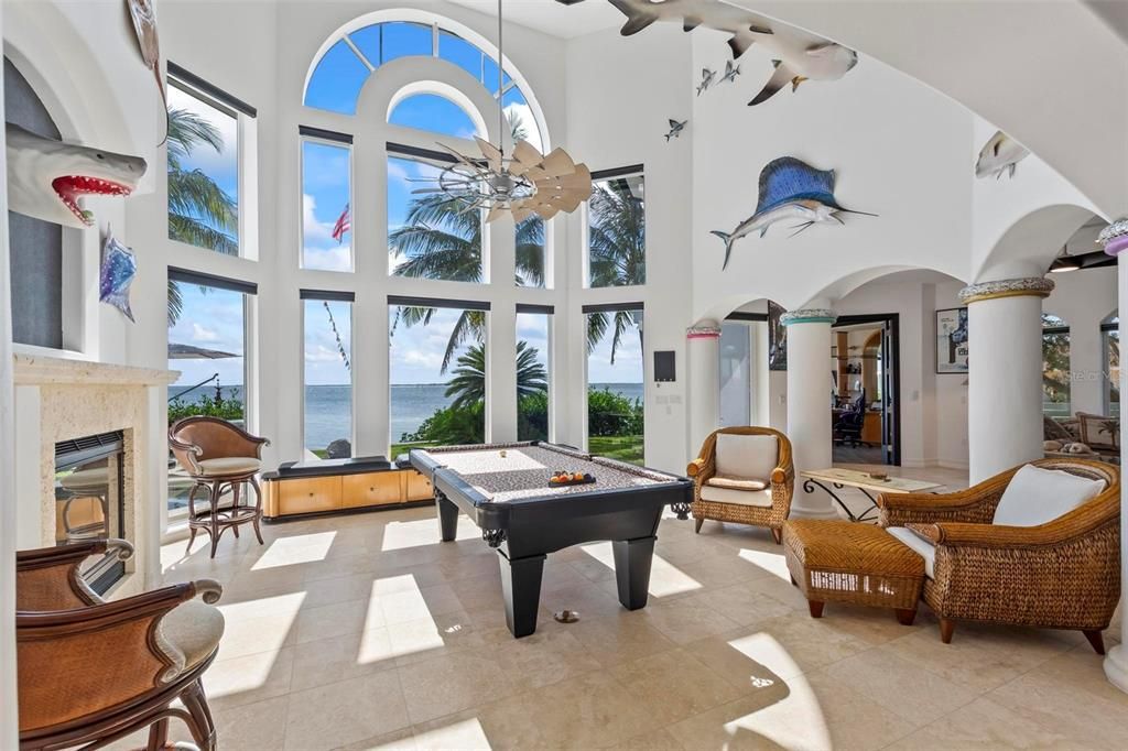 Discover the epitome of luxury living at 2 River Falls Drive, Cocoa Beach, Florida. This 5-bedroom, 6-bathroom custom estate, fully remodeled in 2022, offers 150 feet of pristine river frontage and unobstructed views.